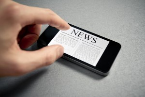 Touching News On Mobile Smartphone