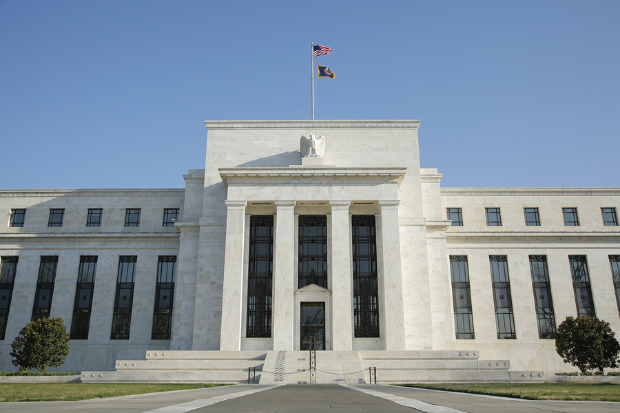 Federal Reserve official warns central bank could delay QE taper