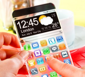 Smart phone (phablet) with a transparent display in human hands.