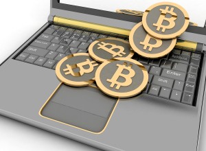 Bitcoins on laptop
