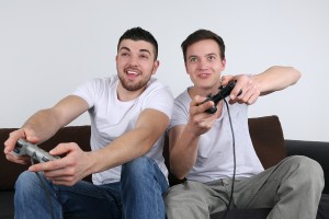 Young People Having Fun While Playing Video Games
